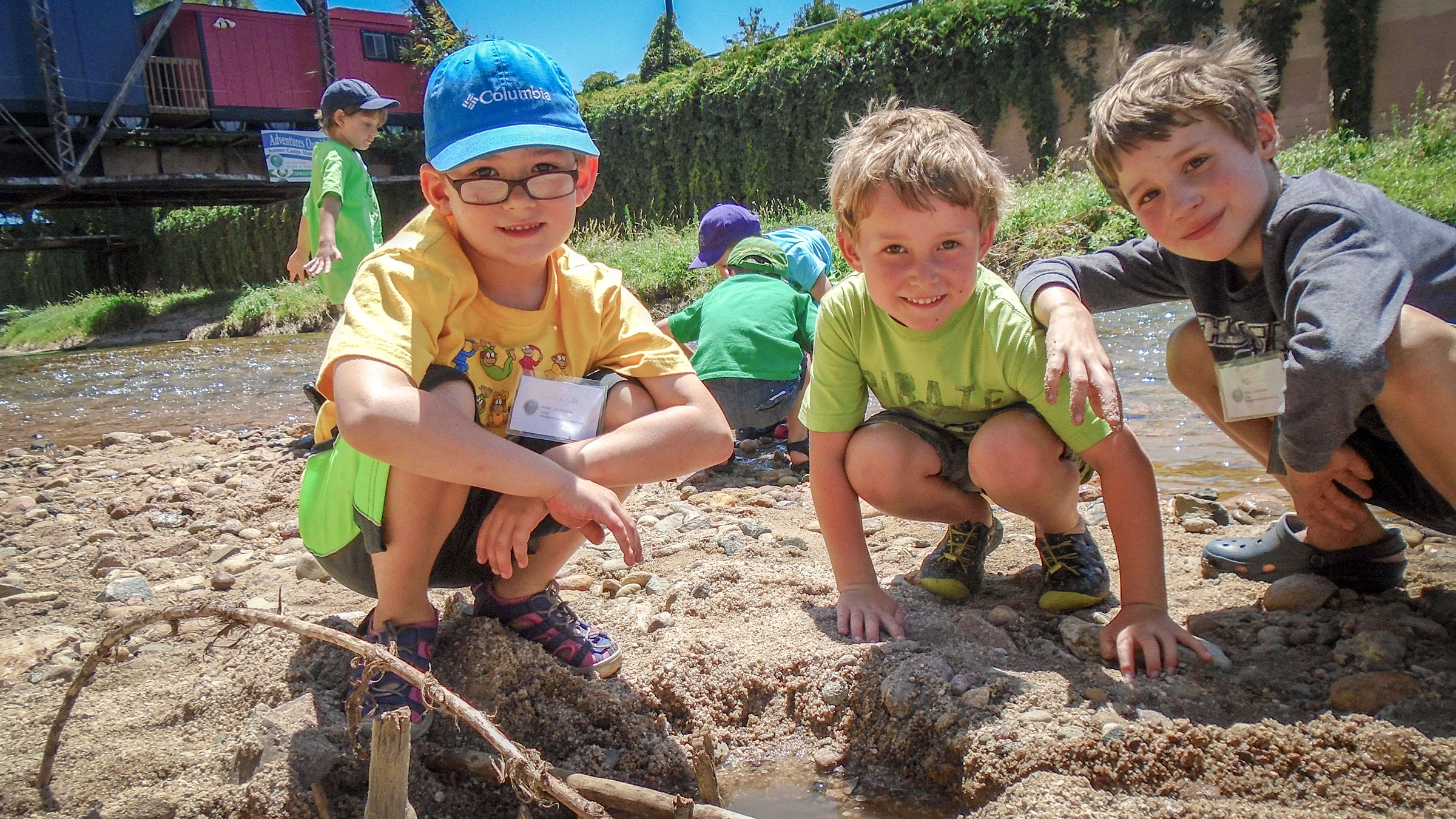 Campers at SPREE Summer Camp dig into the bank along the South Platte River