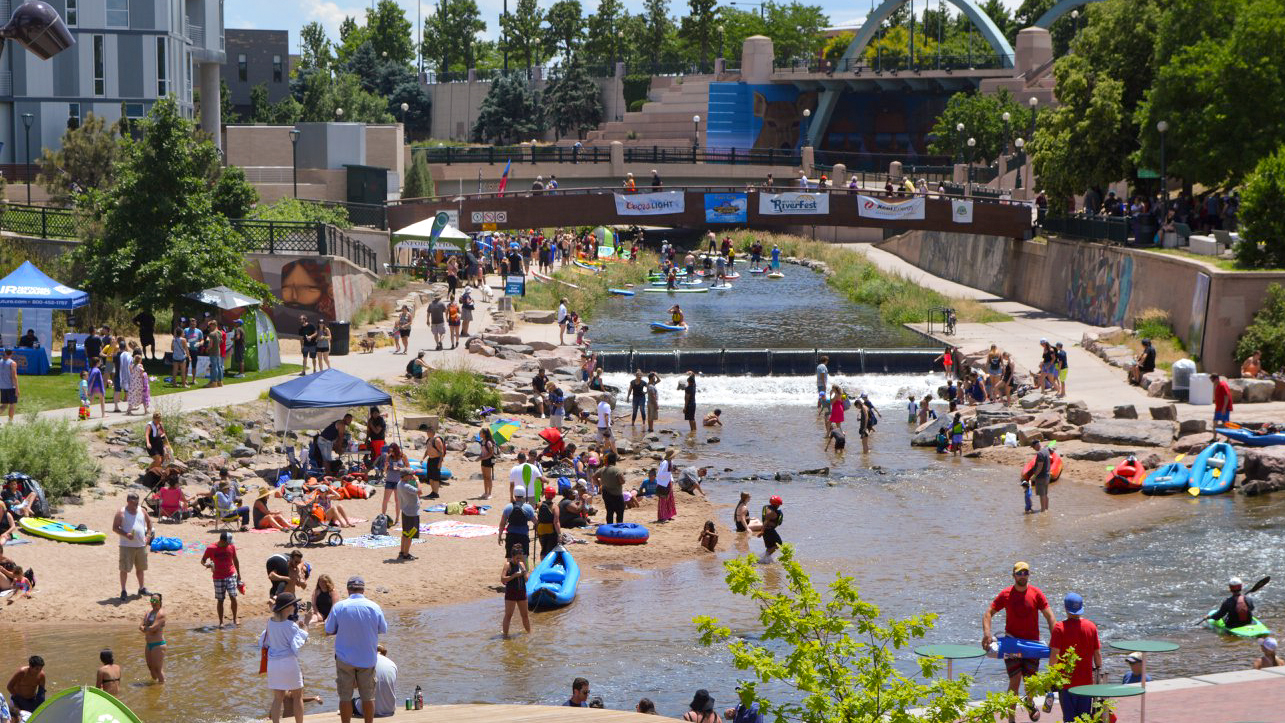 Thousands of people gather for CrossCurrents on the South Platte River