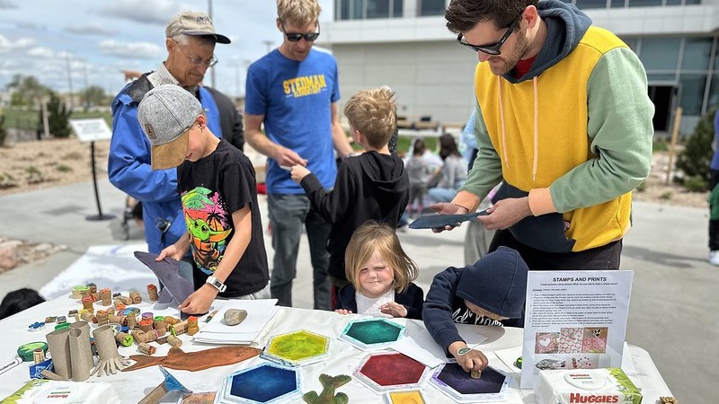 art on the river with families and stamping